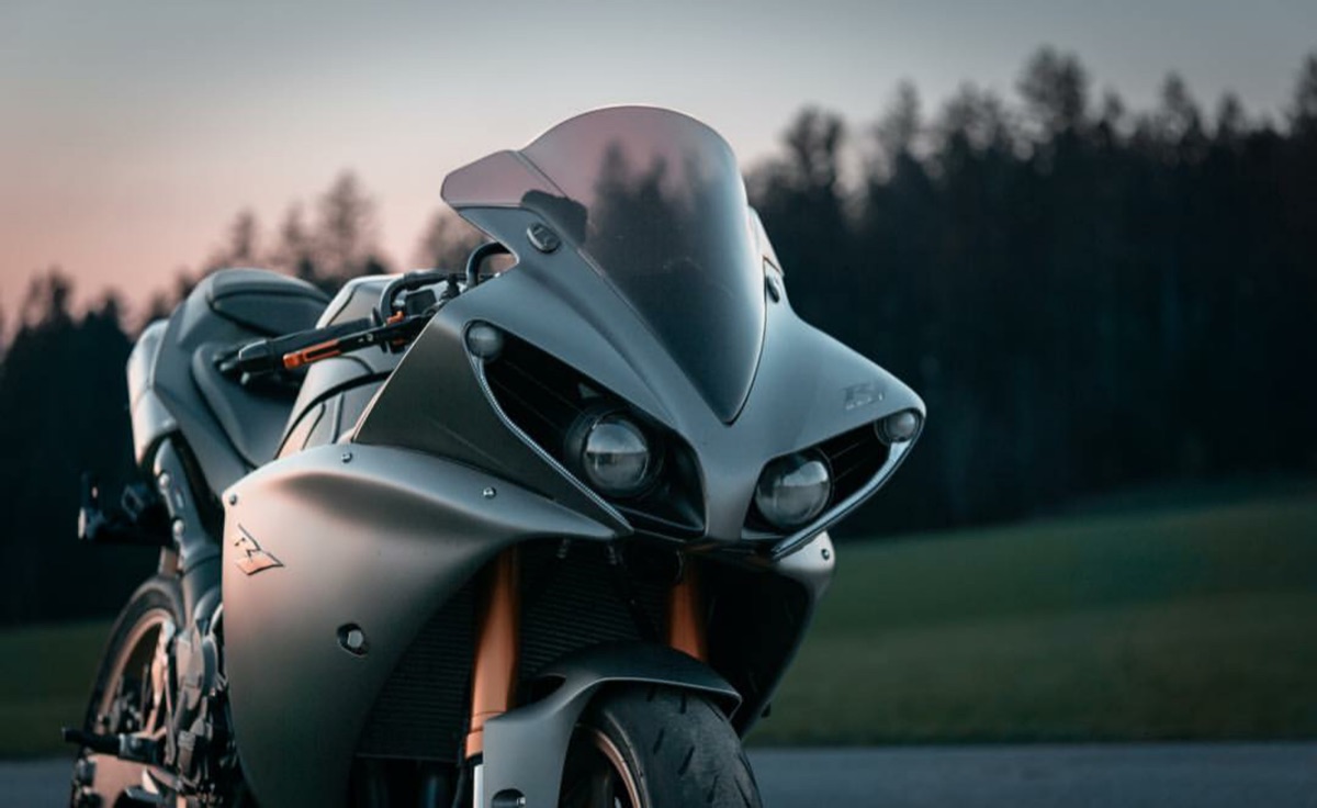 Close up of aerodynamic carbon fiber components on a racing motorcycle.