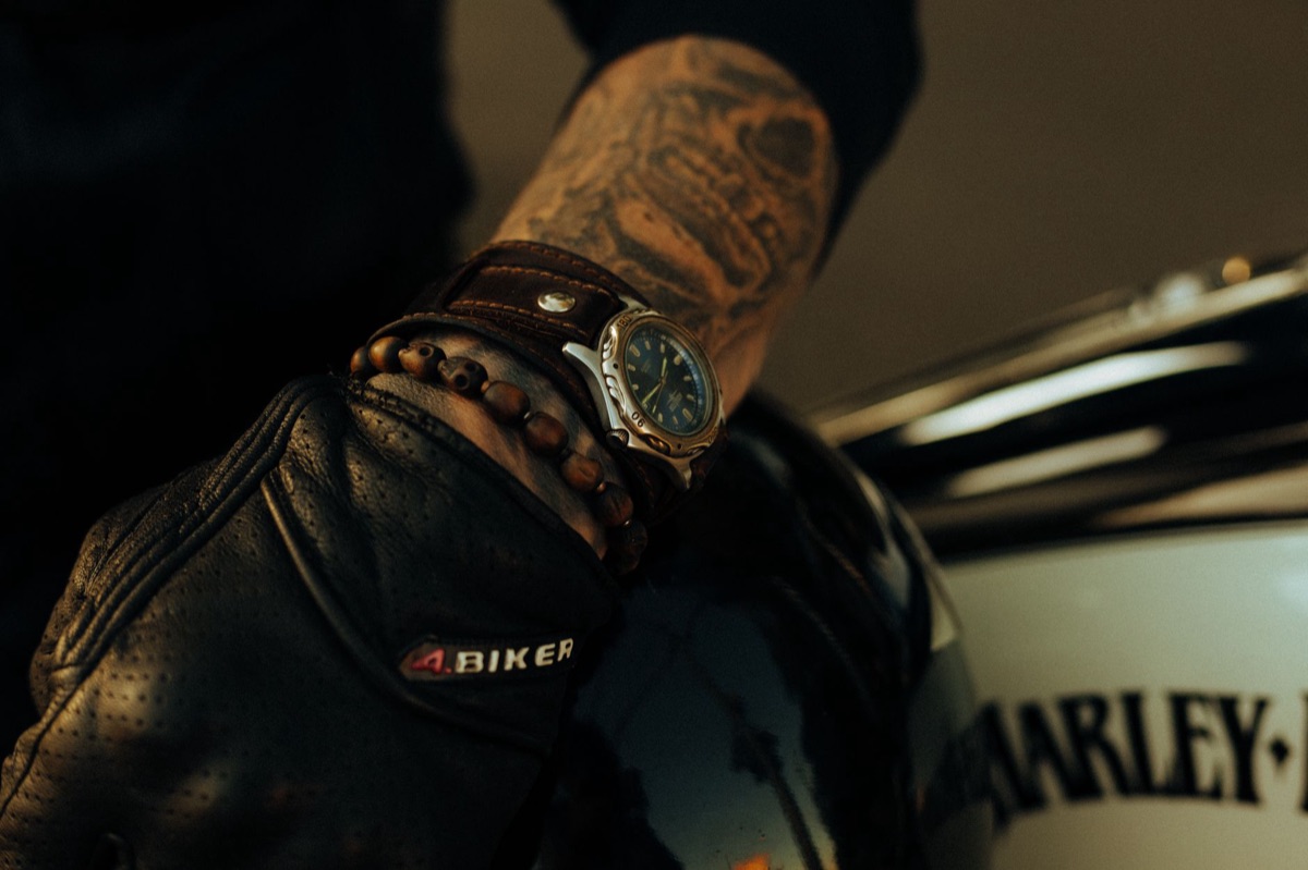 Pair of technical motorcycle riding gloves displayed on a neutral surface
